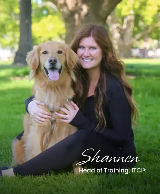 Shannen, Head of Training at ITCI, posing with a golden retriever